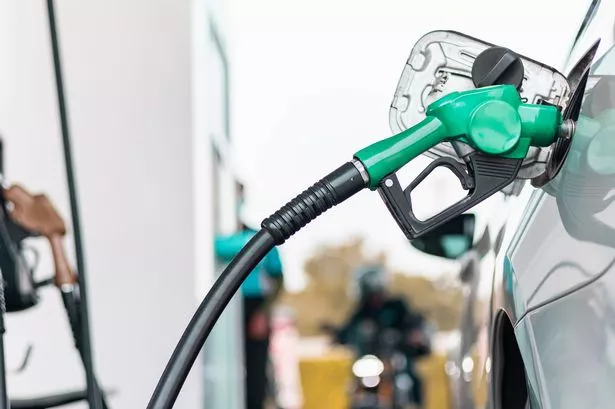 0_Hand-refilling-the-car-with-fuel-close-up